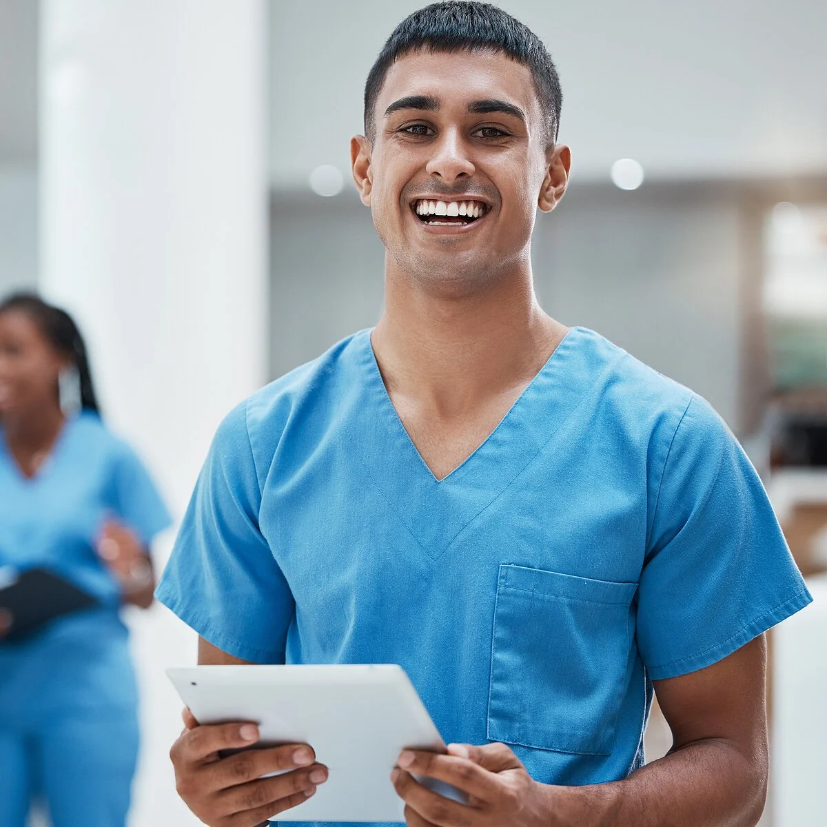 Tablet, healthcare and medicine with a man nurse doing research in a hospital for health or treatment. Medical, insurance and medicare with a young male clinic worker doing a search online Tablet, healthcare and medicine with a man nurse doing research in a hospital for health or treatment. Medical, insurance and medicare with a young male clinic worker doing a search online.